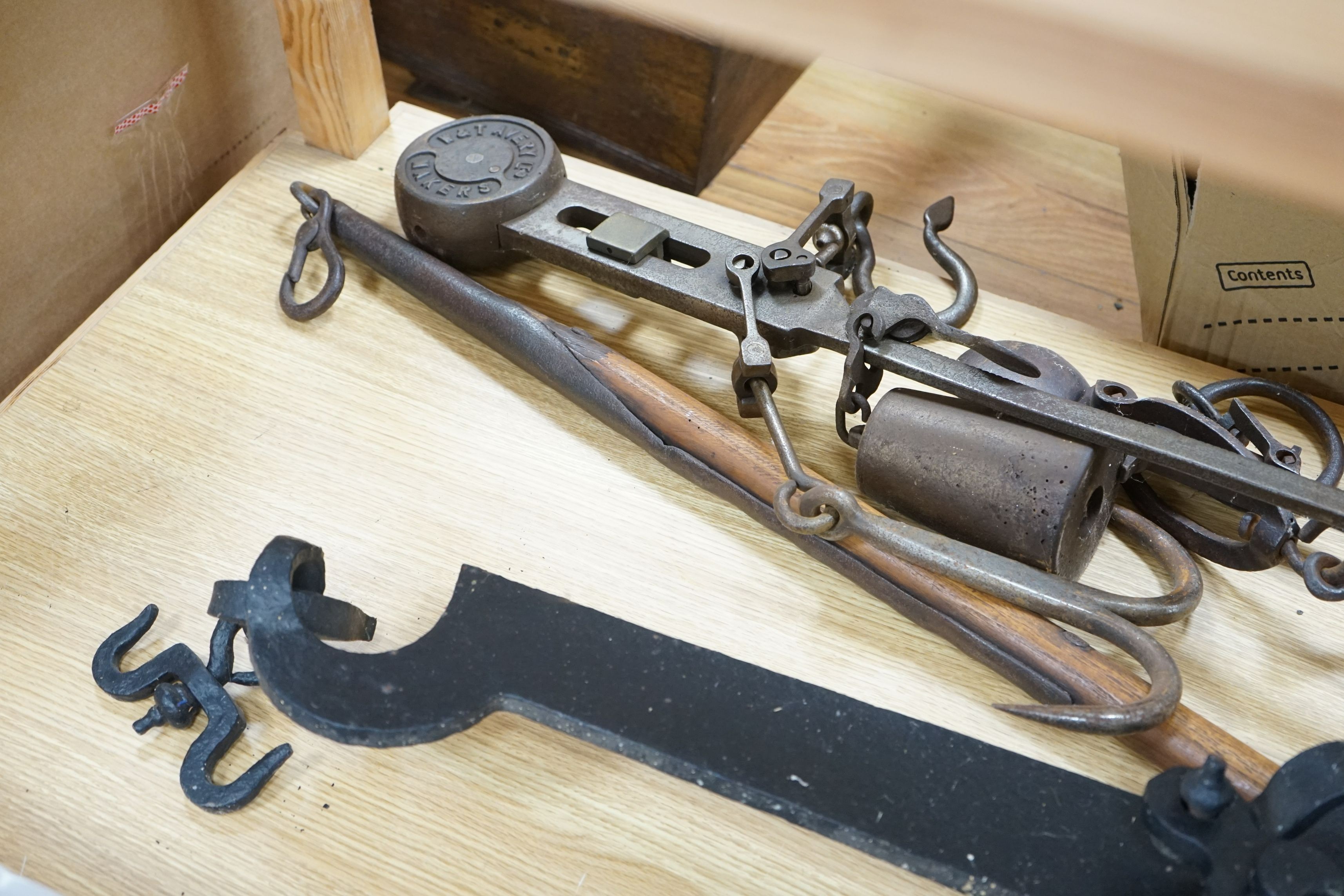 A large beam scale, brass scale: W &T Avery LTD and a similar cast iron scale, 103cm wide